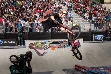 BMX driver doing tricks at the x games in Barcelona
